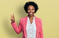 African american woman with afro hair wearing business jacket showing and pointing up with fingers number three while smiling Royalty Free Stock Photo