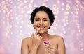 african american woman applying lip gloss Royalty Free Stock Photo