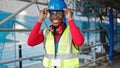 African american woman architect smiling confident wearing hardhat at street Royalty Free Stock Photo