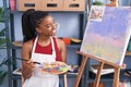 African american woman artist smiling confident drawing at art studio Royalty Free Stock Photo