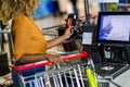 African American Woman with bank card buying food at grocery store or supermarket self-checkout Royalty Free Stock Photo