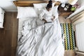 African American woman on bed using a laptop