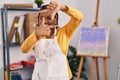 African american woman with braids at art studio smiling making frame with hands and fingers with happy face Royalty Free Stock Photo