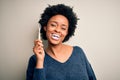 African american woman brushing her teeth using tooth brush and oral paste, cleaning teeth and tongue as healthy health care Royalty Free Stock Photo