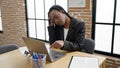 African american woman business worker boring using laptop working at office Royalty Free Stock Photo