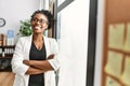 African american woman business worker smiling confident standing with arms crossed gesture at office Royalty Free Stock Photo