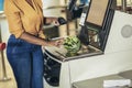 African American Woman buying food at grocery store or supermarket self-checkout Royalty Free Stock Photo