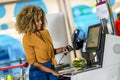 African American Woman buying food at grocery store or supermarket self-checkout Royalty Free Stock Photo