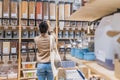 African american woman buying organic cereals and grains in sustainable zero waste grocery store. Young woman refilling Royalty Free Stock Photo