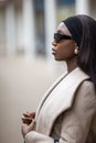 Elegant Woman with Sunglasses in Urban Setting Royalty Free Stock Photo