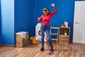 African american woman cleaning floor dancing at laundry room Royalty Free Stock Photo