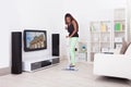 African American woman cleaning floor in living room Royalty Free Stock Photo