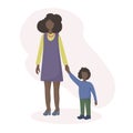 An African-American woman with dark skin is walking around holding the hand of her little son. Motherly love. The concept of famil
