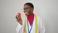 African american woman dietician smiling confident holding apple over isolated white background