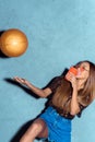 african american woman with disposable cup throwing golden