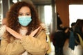 African-American woman with disposable mask. Virus protection