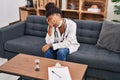 African american woman doctor patient stressed having psychology session at psychology center Royalty Free Stock Photo