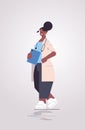 African american woman doctor in uniform holding checklist medicine healthcare concept