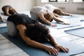 African American woman doing Balasana exercise at group yoga lesson Royalty Free Stock Photo