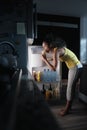 Black Woman Looking into Fridge For Midnight Snack