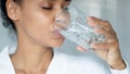 African American woman drink water from glass Royalty Free Stock Photo