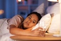 african american woman drinking water at night Royalty Free Stock Photo