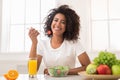 African-american woman with vegetable salad and fresh juice Royalty Free Stock Photo