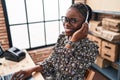 African american woman ecommerce call center agent working at office Royalty Free Stock Photo