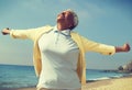 African american woman enjoying fresh air on beach