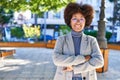 African american woman executive smiling confident standing with arms crossed gesture at park Royalty Free Stock Photo