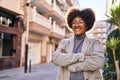 African american woman executive smiling confident standing with arms crossed gesture at street Royalty Free Stock Photo