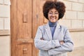 African american woman executive smiling confident standing with arms crossed gesture at street Royalty Free Stock Photo