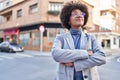 African american woman executive smiling confident standing with arms crossed gesture at street Royalty Free Stock Photo