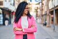 African american woman executive standing with arms crossed gesture at street Royalty Free Stock Photo