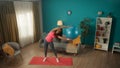 African American woman exercising with a fitness ball. A sporty woman does side bends with a fitball in her hands. Young Royalty Free Stock Photo