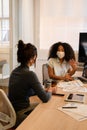 Woman explaining project details to colleague Royalty Free Stock Photo