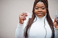 African american woman in eyeglasses hold syringe vaccine