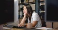 African American woman focuses on her laptop at the business office