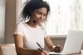 African American woman in headphones watch webinar on laptop Royalty Free Stock Photo