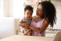 African-American woman with her baby. Happiness of motherhood Royalty Free Stock Photo