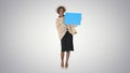 African American Woman Holding a Blank Placard on gradient backg Royalty Free Stock Photo