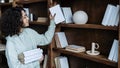 African american woman holding books in hands Royalty Free Stock Photo