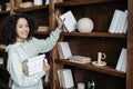 African american woman holding books in hands Royalty Free Stock Photo