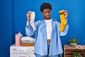 African american woman holding clean andy dirty socks skeptic and nervous, frowning upset because of problem Royalty Free Stock Photo