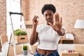 African american woman holding keys of new home with open hand doing stop sign with serious and confident expression, defense Royalty Free Stock Photo