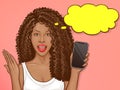 African american woman holds smartphone Royalty Free Stock Photo