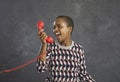 African american woman irritated and angrily shouting into the phone arguing with the operator. Royalty Free Stock Photo