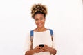 African american woman listening music against white background Royalty Free Stock Photo