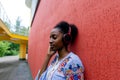 African American woman listens to music with headphones on the street Royalty Free Stock Photo