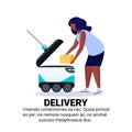 African american woman loading box robot self drive fast delivery goods in city car robotic carry concept isolated copy